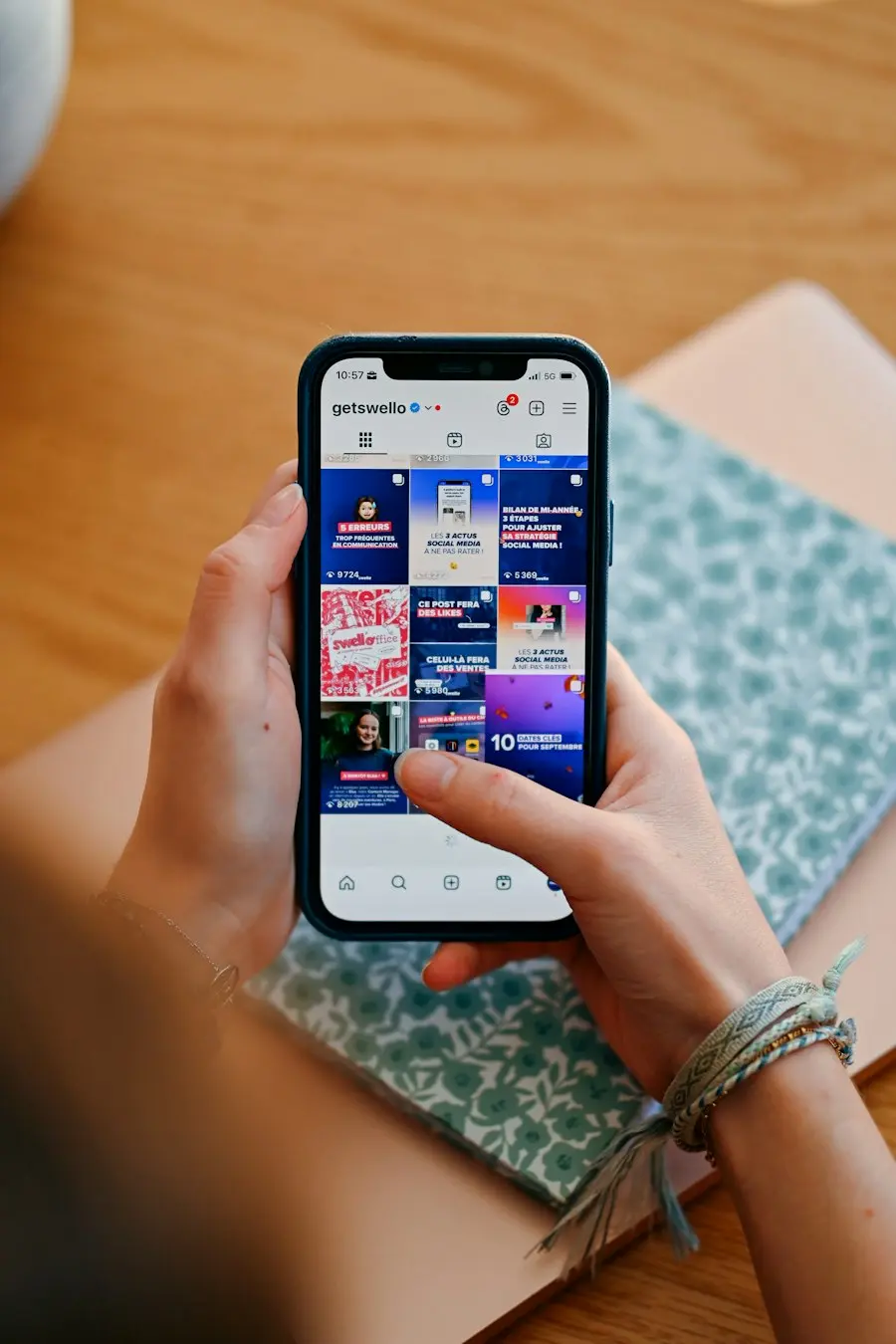 Hands holding a phone scrolling a social media feed, representing TikTok ads in the wild